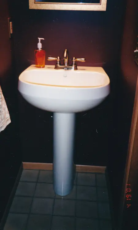 This shows how small the bathroom looked before with the dark cranberry walls.