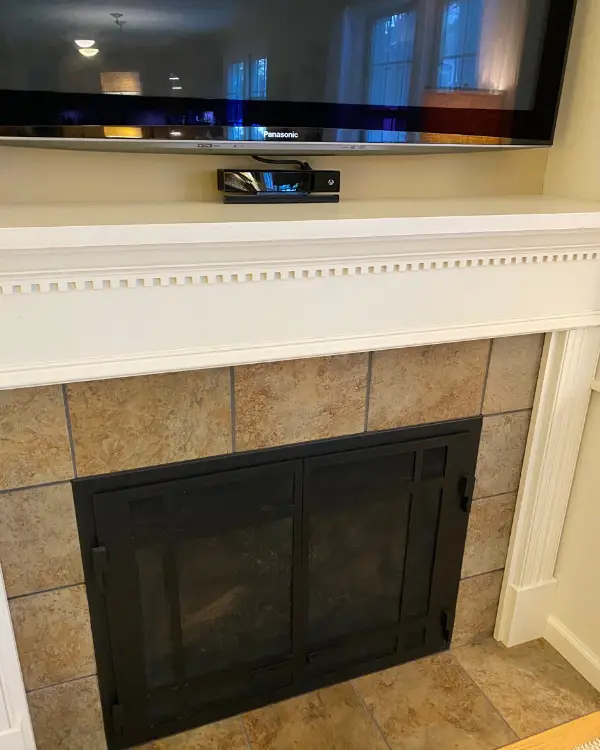 How the mantel and tile looked before the makeover.