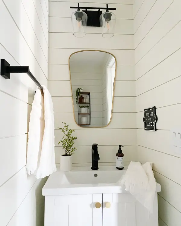 Bathroom with shiplap painted in SW alabaster, one of my favorite paint colors.