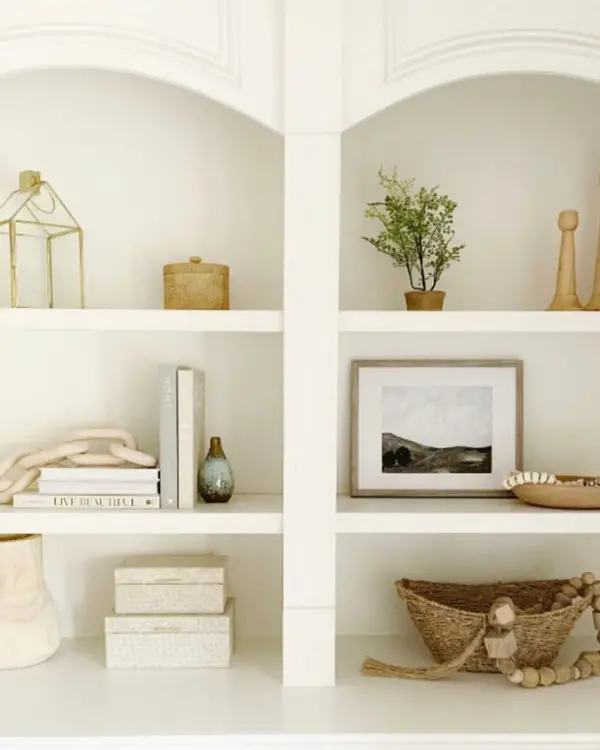 She used different textures when styling her shelves like wood, wicker, glass and ceramic.