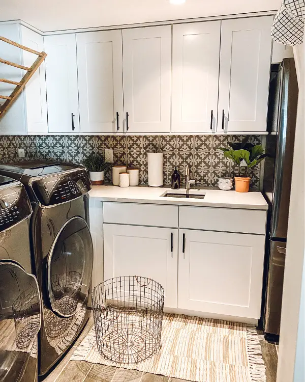Cabinets in the laundry room in the basement for extra storage. Storage is one of the 10 things you won't regret doing when finishing a basement.