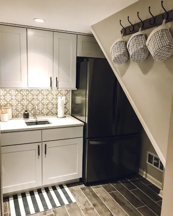 We squeezed an extra refrigerator into the laundry room. 