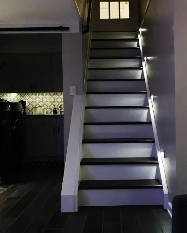 Stair lights in the basement at night. You won't regret adding them when finishing the basement!