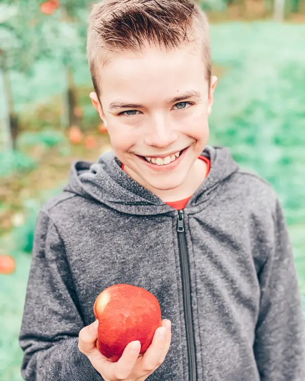 My son in the apple orchard.
