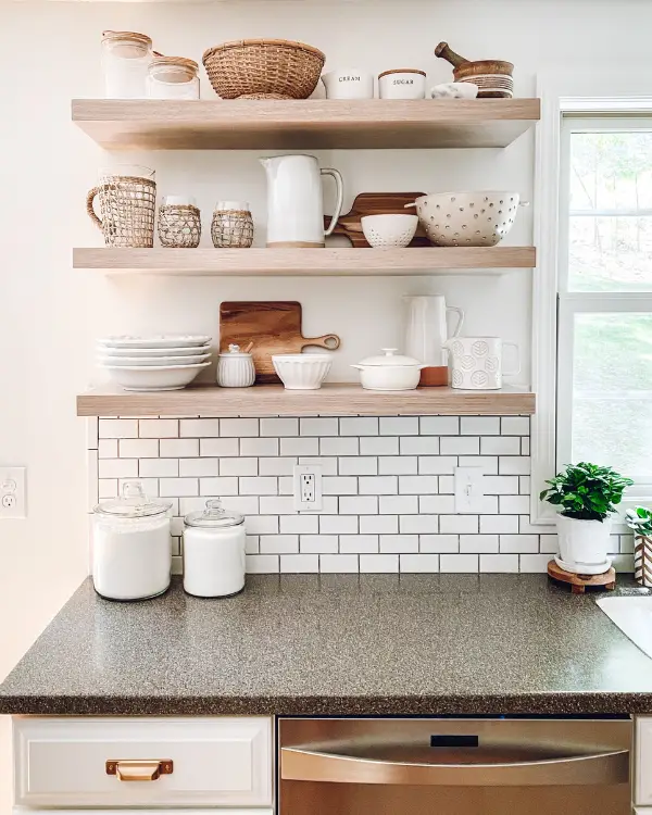 The floating shelves decorated with neutral items