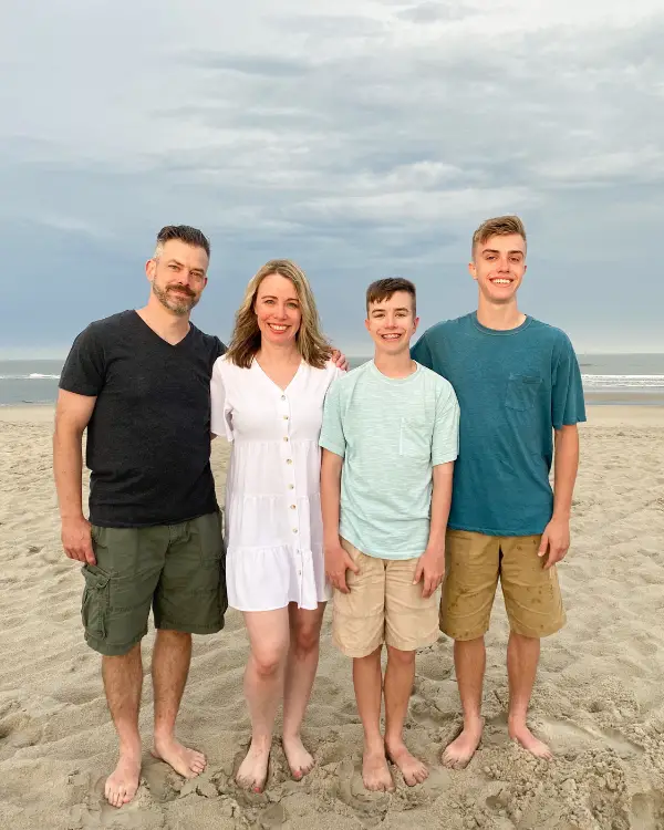 our family at the beach wearing outfits for beach photos