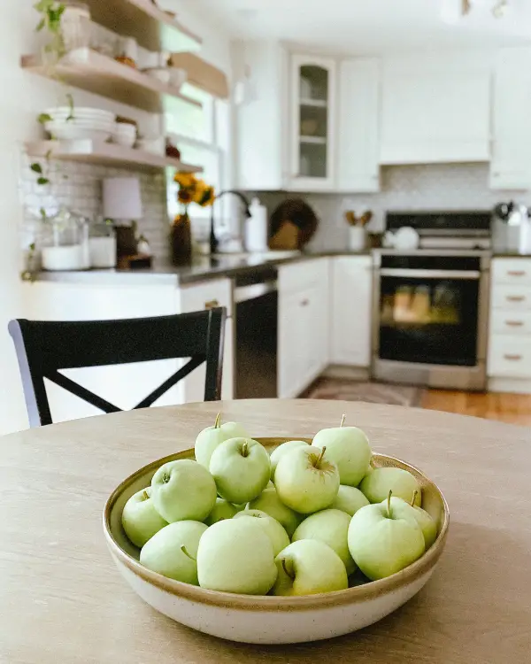 A bowl of apples as a centerpiece in the kitchen