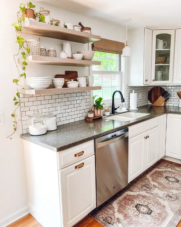 The completed kitchen remodel including open shelving and a bamboo shade.