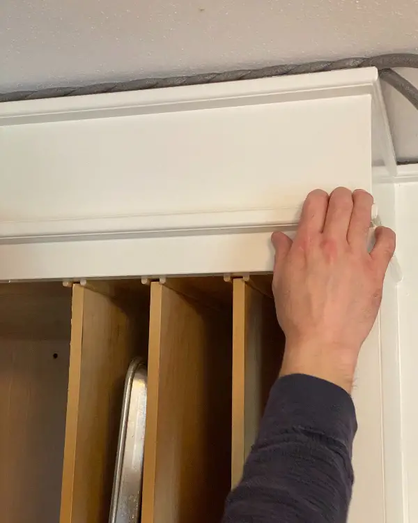 Filling the gap between cabinet and ceiling with twisted backer rod first.