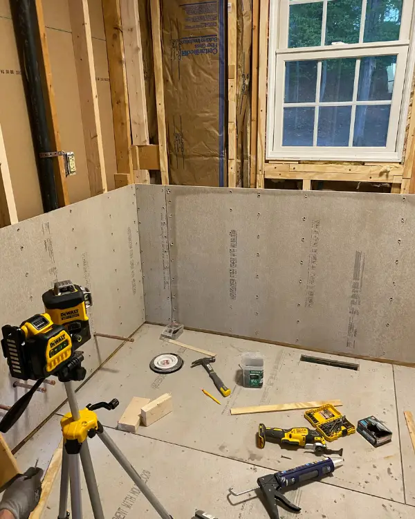 installing the cement board in the wall