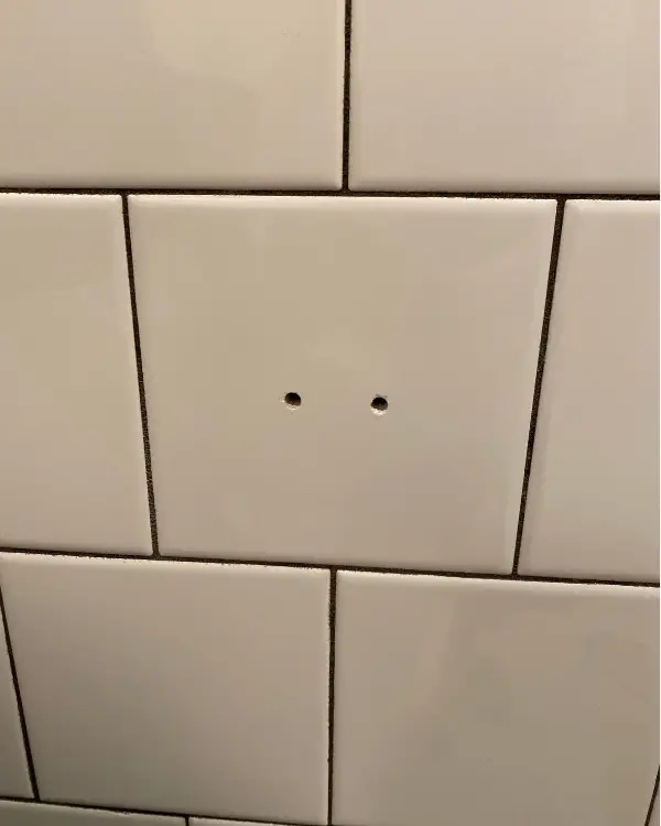 the holes after drilling into the tile