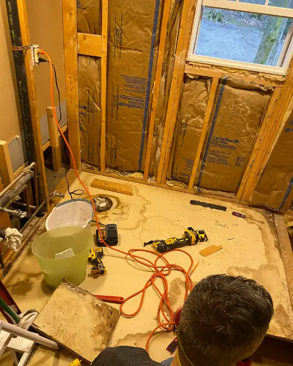 the original bathroom floor being torn up