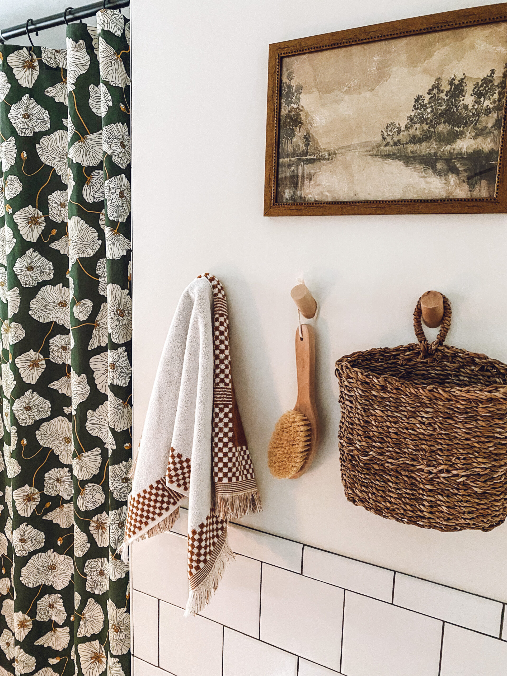 Towel, bath brush and basket hanging on hook