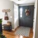 This dark gray front door has the trim painted to match