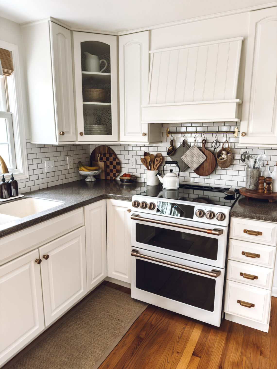 white electric GE Cafe stove in my white kitchen