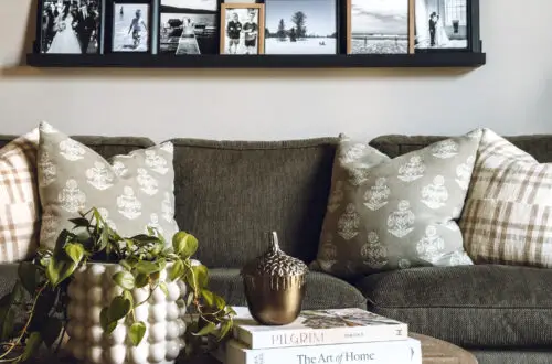 photo ledges displaying all black and white photos in only black or natural wood frames